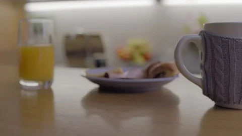 Picking up Phone from Breakfast Table 2 Stock Footage 72831010