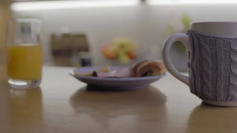 Picking up Phone from Breakfast Table 3 Stock Footage 72830851