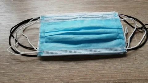 Picking Up A Piece Of Mask On The Table During Coronavirus Stock Footage 130400471