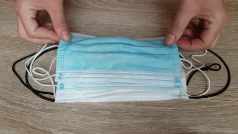 Picking Up A Piece Of Mask On The Table During Coronavirus Stock Footage 130400809