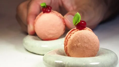 Picking Up A Pink Raspberry Macaroon At A Michelin Starred Restaurant, UK Stock Footage 274440899