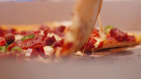Picking Up Pizza Slice with Stringy Cheese Pull with Meat Toppings of Stock Footage 340819145