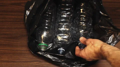 Picking plastic bottles for disposal Stock-Footage 218192129