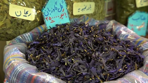 Picking purple like spice from a bag Stock Footage 100847671