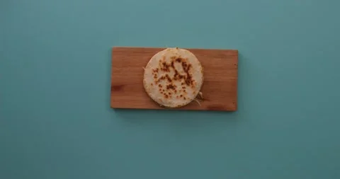 Picking up a quesadilla on a tray 1 Stock Footage 132203597