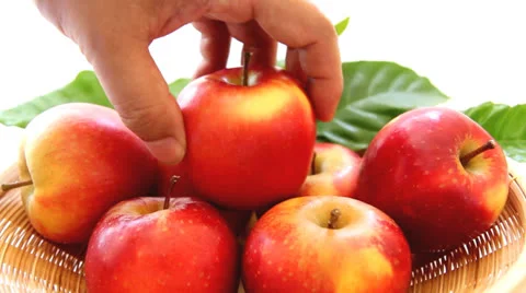 Picking up red apple from the basket Stock Footage 25681401