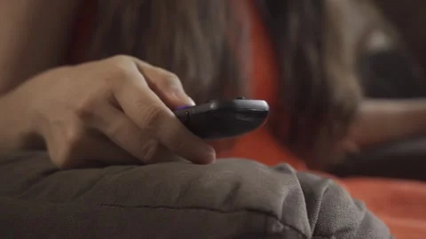 Picking up the remote control. Stock Footage 248193107
