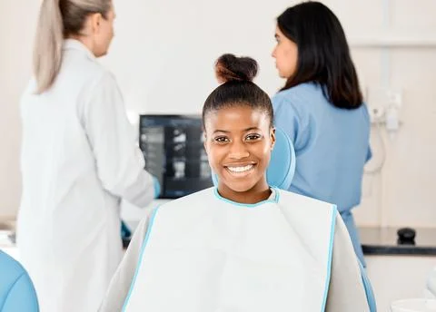 Picking the right dentist matters. a young woman awaiting treatment in her Stock Photos