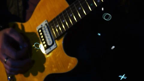 Picking ringed hand sliding guitar near pickups bridge knobs cam aiming cross at Stock-Footage 332867126
