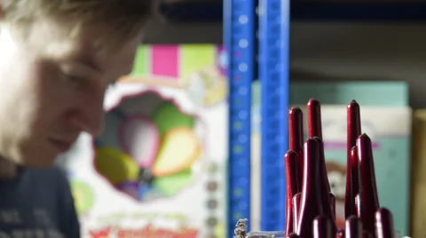 Picking a Set of Paintbrushes from a Shelf Stock Footage 62680229