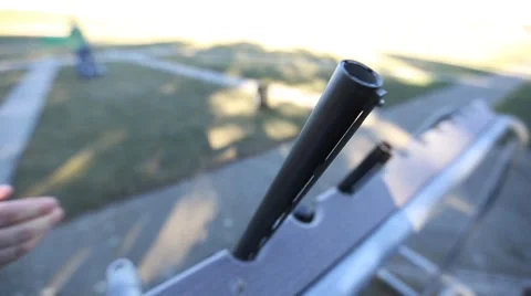 Picking up shotgun off the rack Stock Footage 54846822