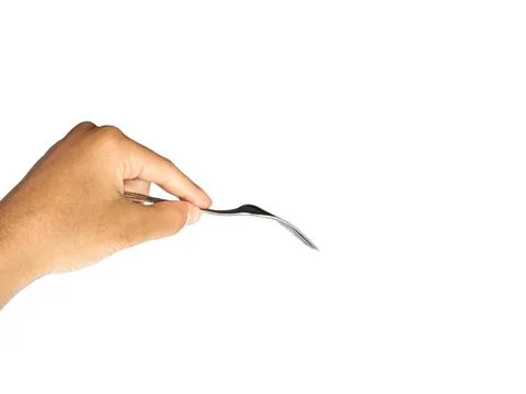 Picking something with fork Stock Photos