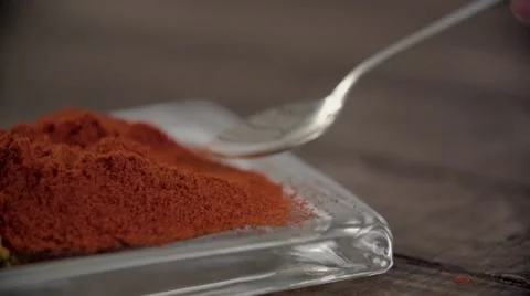 Picking up spoonful of chilly powder. Stock Footage 54483059