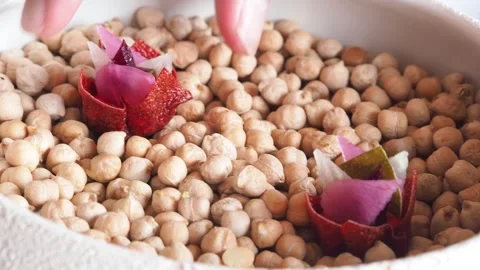 Picking up a thinly sliced red beet, radish and a caper leaf bite, Netherlands. Stock Footage 274440936