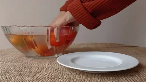 Picking the tomatoes into a white plate Stock Footage 149957560