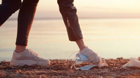 Picking up trash at the beach. Stock Footage 143667010