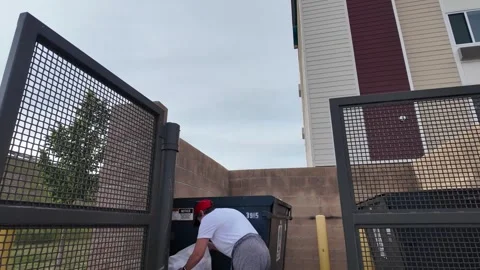 Picking Up Trash Near Dumpster Outside Building Apartment Office Condo Stock Footage 340429822