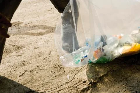 Picking up trash outdoors Stock Photos