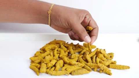 Picking turmeric isolated over white background Stock Footage 147695627