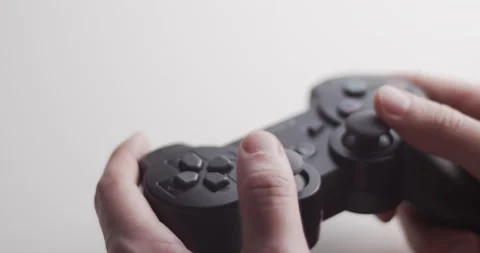 Picking up video game joystick controller and playing - isolated concept video Stock Footage 146541051