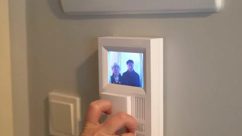 Picking up the videophone intercom in 4k Stock Footage 92831485