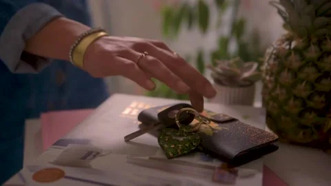 Picking up wallet and keys Stock Footage 164381500