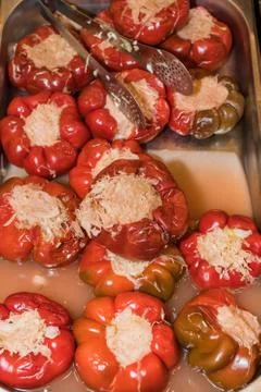 Pickle peppers stuffed with cabbage in a rustic bowl over a white background Stock Photos