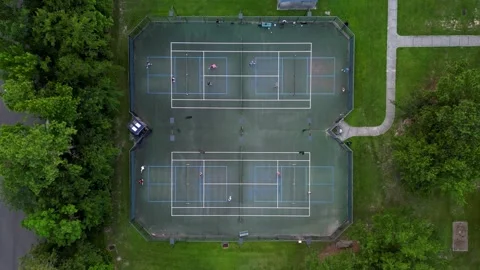 Pickleball day time drone shot four courts drop down Vídeos de archivo 279846189