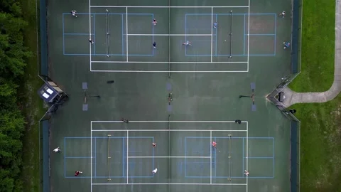 Pickleball day time drone shot four courts pulling up Vídeos de archivo 279846191