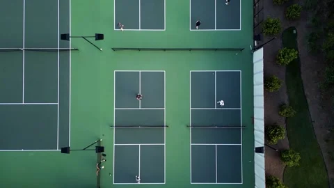 Pickleball four courts slow pull forward top down view.MP4 Vídeos de archivo 279958752