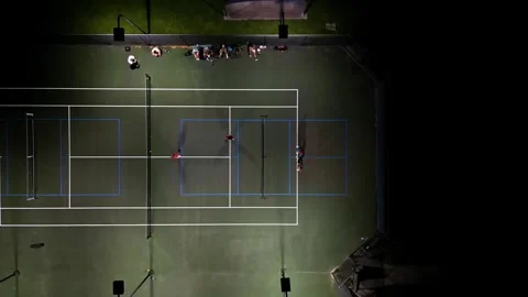 Pickleball night time drone shot  dropping down one court quick point Vídeos de archivo 279846222