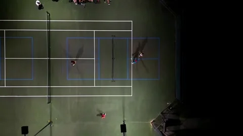 Pickleball night time drone shot panning up two courts Vídeos de archivo 279846224