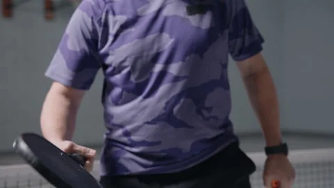 Pickleball player bouncing ball on racket Stock Footage 299430645