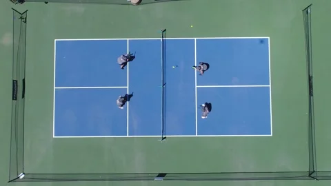 Pickleball players looking straight down on court Stock Footage