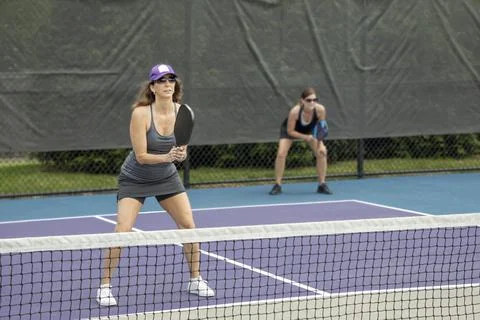 Pickleball Players Prepare to Return a Serve Stock Photos