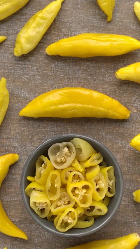 Pickled and raw Aji Cito peppers. Vertical video. Stock Footage 282800267