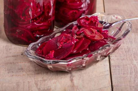 Pickled beets in jars and bowl Stock Photos