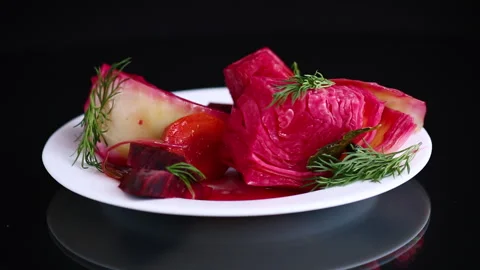 Pickled cabbage with beets and carrots, in a plate Stock Footage 297689615