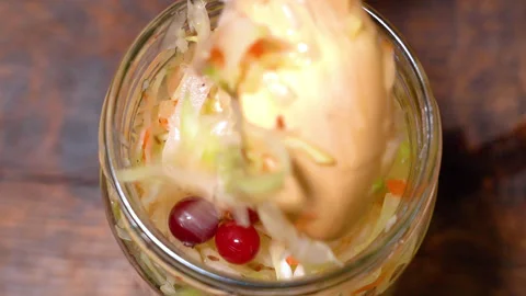 Pickled cabbage with carrots in a glass jar. Видео 251797656
