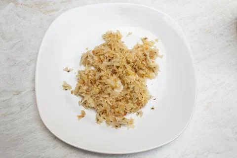 Pickled cabbage on a white ceramic plate soft focus flat lay close up Stock Photos