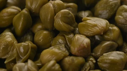 Pickled capers close up full frame as background. Loopable Capres Video Stock Footage 265701592