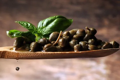 Pickled capers in the spoon Stock Photos