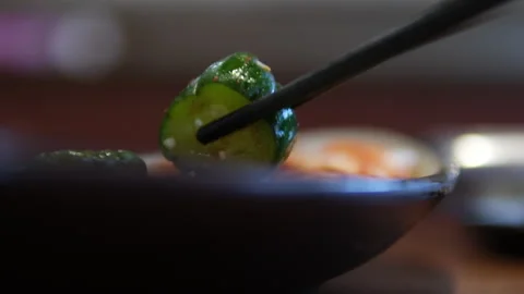 Pickled cucumber focused on making cucumber pickles in her home kitchen. She Stock Footage 316049746