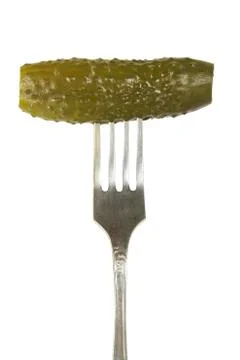 Pickled cucumber on a fork Stock Photos