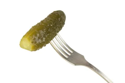 Pickled cucumber on a fork Stock Photos