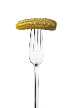 Pickled cucumber on a fork Stock Photos
