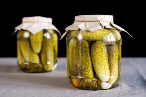 Pickled cucumbers on black background Stock Photos