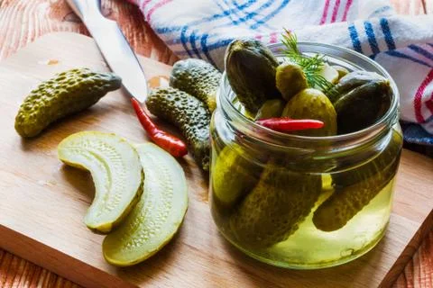 Pickled cucumbers in a jar Stock Photos