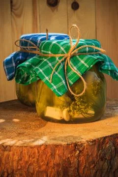 Pickled cucumbers jars wooden table Stock-Fotos