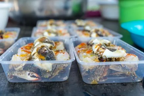 Pickled egg crab in plastic box for sale to tourists Stock Photos